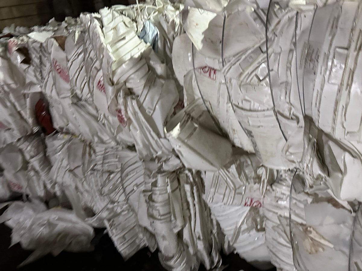 Baled white woven PP supersacks stacked for shipping