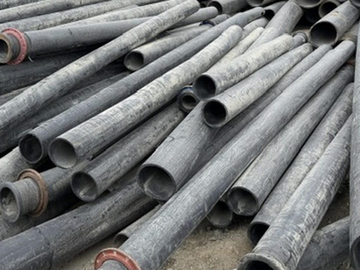 Stacked lengths of whole HDPE pipe with flanged ends